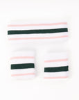 A pack of "Birdie Bands" from Fore All's collection, designed for active women. The set includes a matching headband and two wristbands in Fore All's signature colors. Perfect for golf, tennis, or workouts, the headband keeps hair in place while the wristbands add style and keep sweat in check.