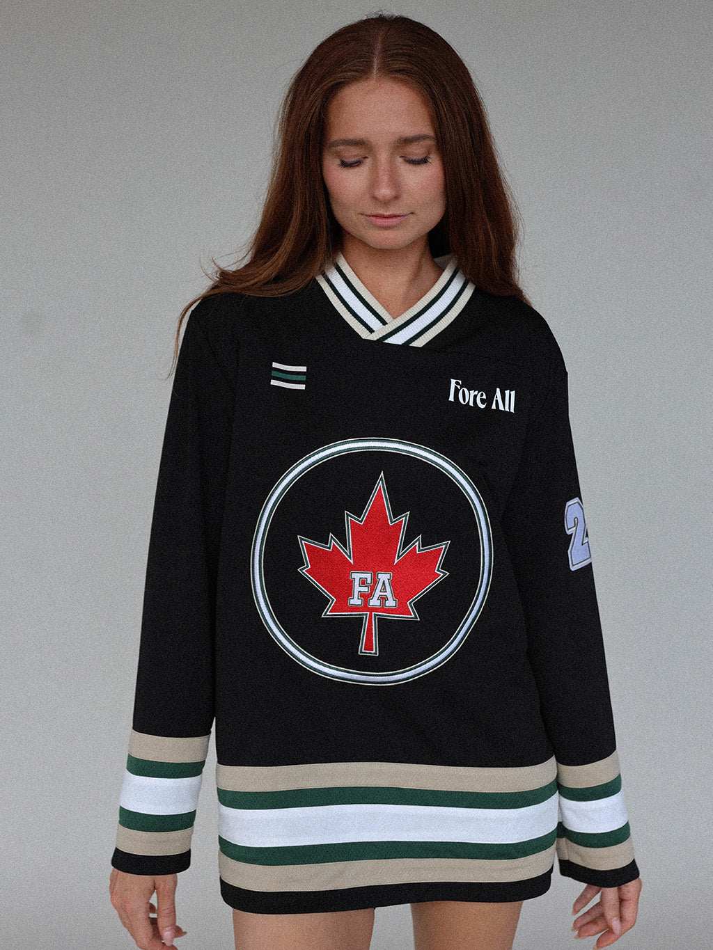 &quot;Close-up of the &#39;Chirp Jersey&#39; from the Royal Collection, featuring autumn-inspired colors. This hockey jersey-inspired piece includes the iconic red maple leaf, &#39;Fore All&#39; details, and the number &#39;4.&#39; Designed to blend tradition and style, it’s perfect for showcasing Canadian pride and adding a standout touch to your wardrobe.&quot;