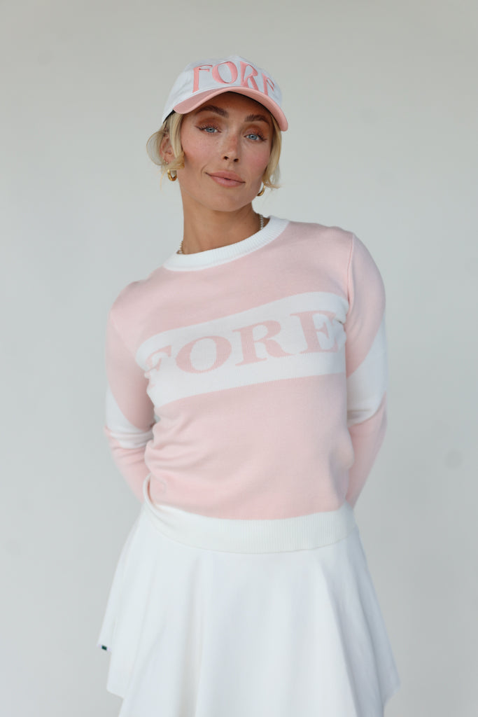 Fore Sweater in Pink/White, a fan-favorite known for its cozy comfort and stylish design, perfect for on and off the golf course.