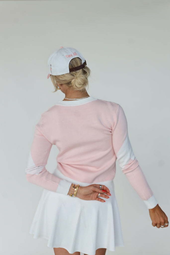 Fore Sweater in Pink/White, a fan-favorite known for its cozy comfort and stylish design, perfect for on and off the golf course.